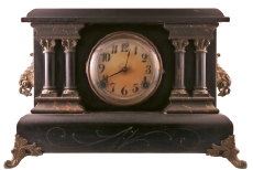 An Old Black Mantel Clock