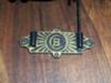 Brass plate with letter B inside letter C