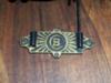Brass plate with letter B inside letter C